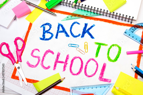Colorful drawing with words "back to school" and school accessories