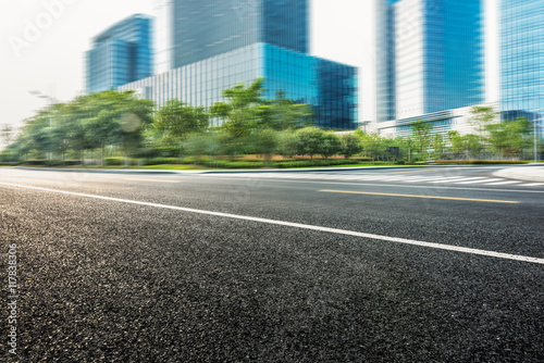 city empty traffic road with cityscape in background