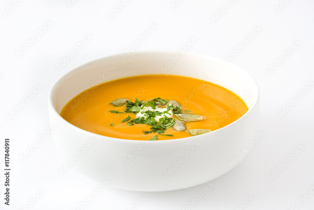 Pumpkin soup with cream and pumpkin seeds isolated on white background
Pumpkin soup with cream and pumpkin seeds isolated on white background