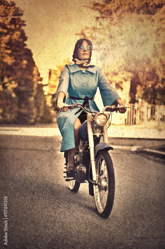 Retro picture of a woman on a motorcycle