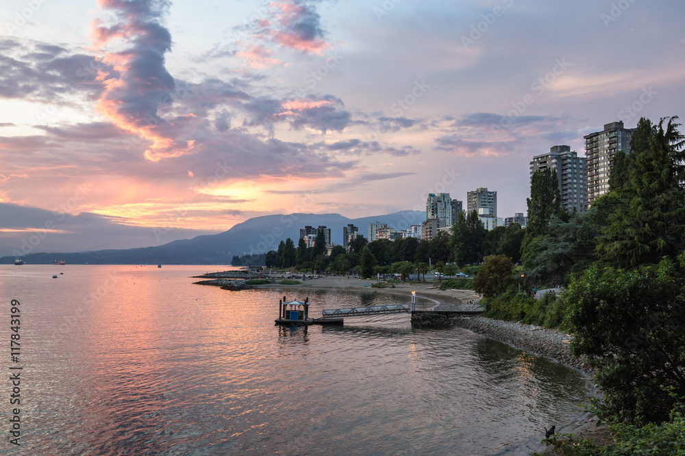 View on the beach and ocean during a beautiful cloudy sunset. Taken in False Creek, Downtown Vancouver, British Columbia, Canada