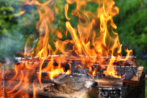 Hot Charcoal Barbecue Grill With Bright Flame On The Nature Back