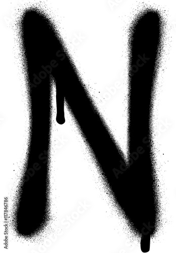 sprayed N font graffiti with leak in black over white