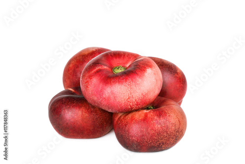 Fresh flat peach fruits on a white background