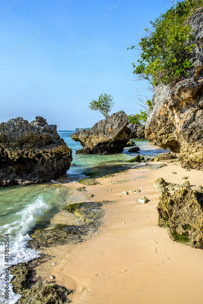 seaside beach by a cliff and with rocks in the water, vertical
seaside beach by a cliff and with rocks in the water, vertical