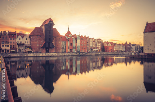 Gdansk old town with harbor and medieval crane in the evening