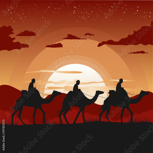 silhouette of camel caravan traveling in desert at sunset