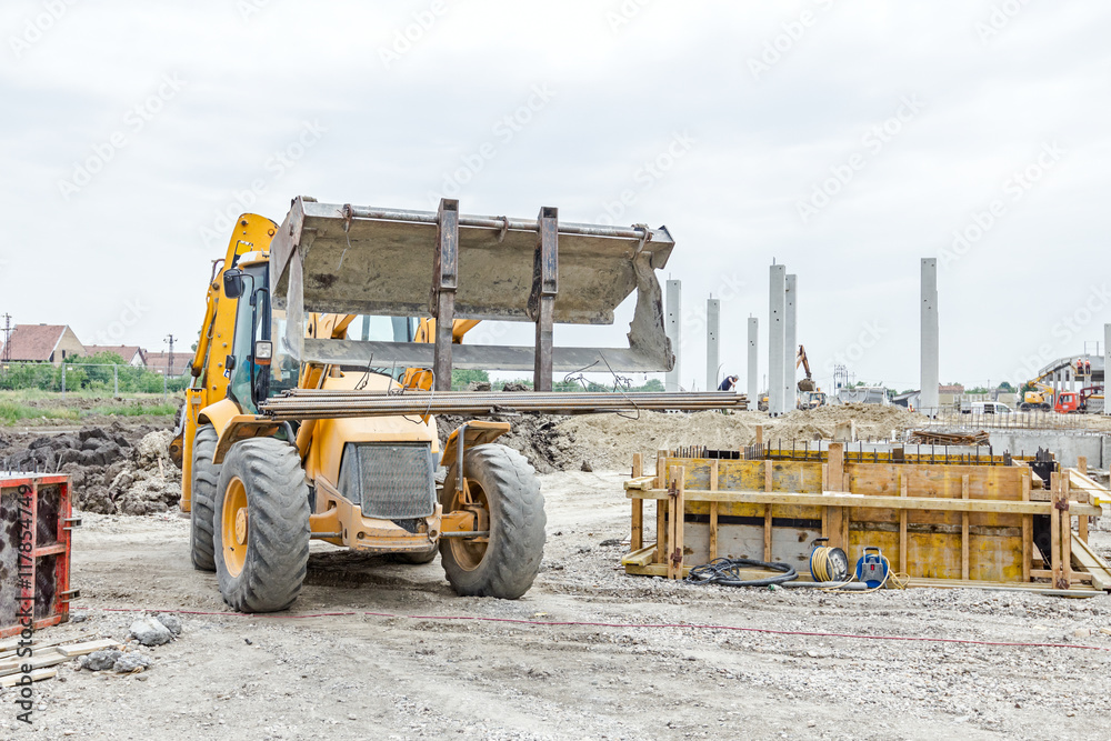 Obraz premium Armature rod delivery at building site. Logistics concept