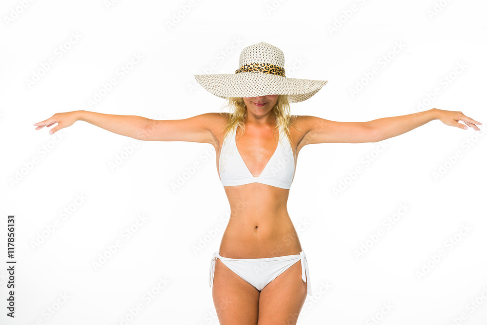 Woman posing in a white bikini over white