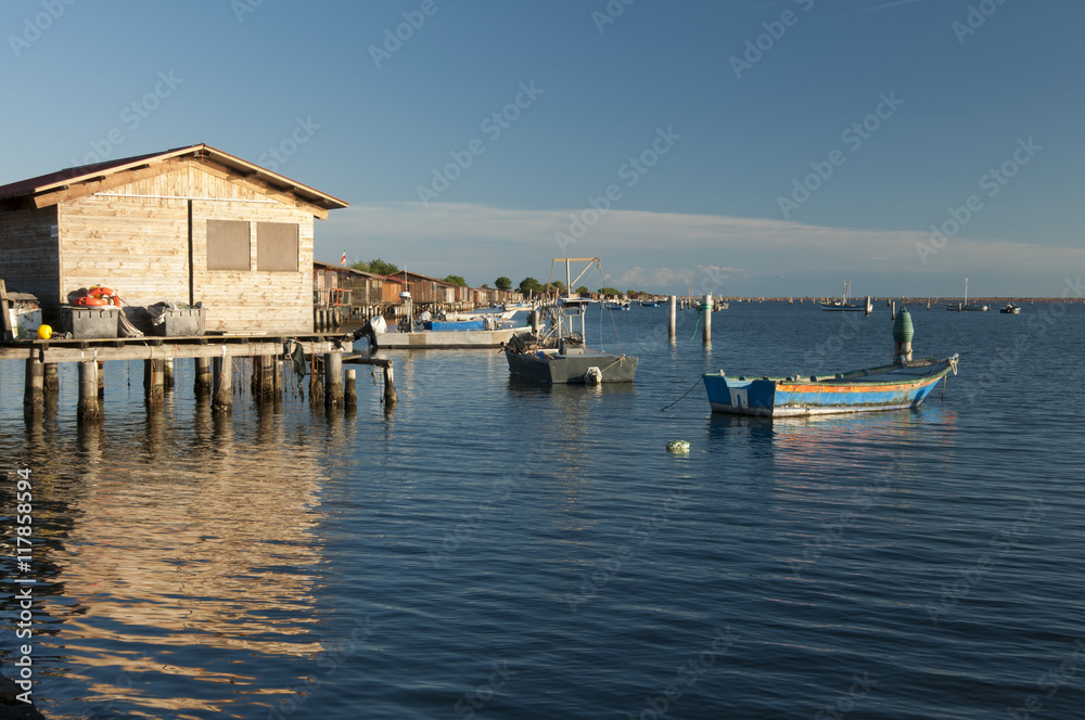 SCARDOVARI, ITALY, 2016-08-06: Fishing huts at Scardovari lagoon SCARDOVARI, ITALY, 2016-08-06: Fishing huts at Scardovari lagoon