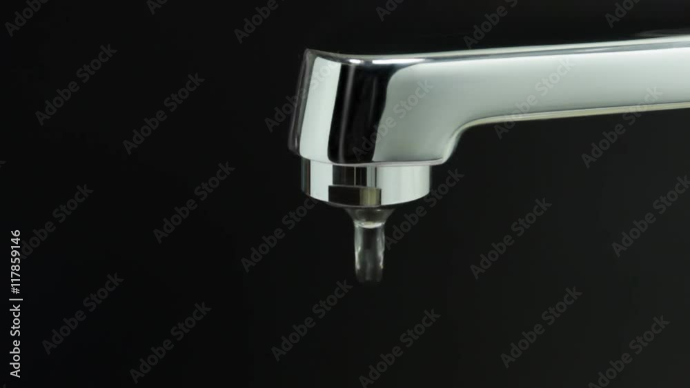 Water dripping from a faulty faucet Water dripping from a faulty faucet