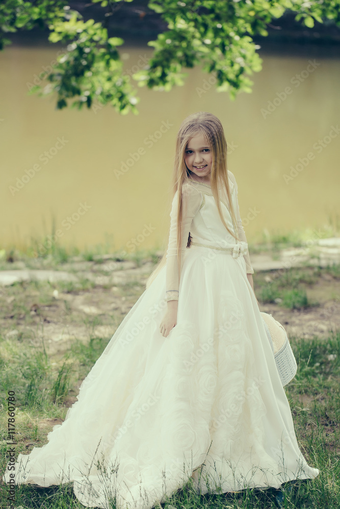 small girl in white dress outdoor