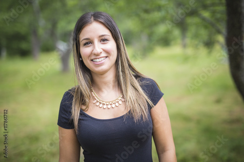 happy young woman in the forest