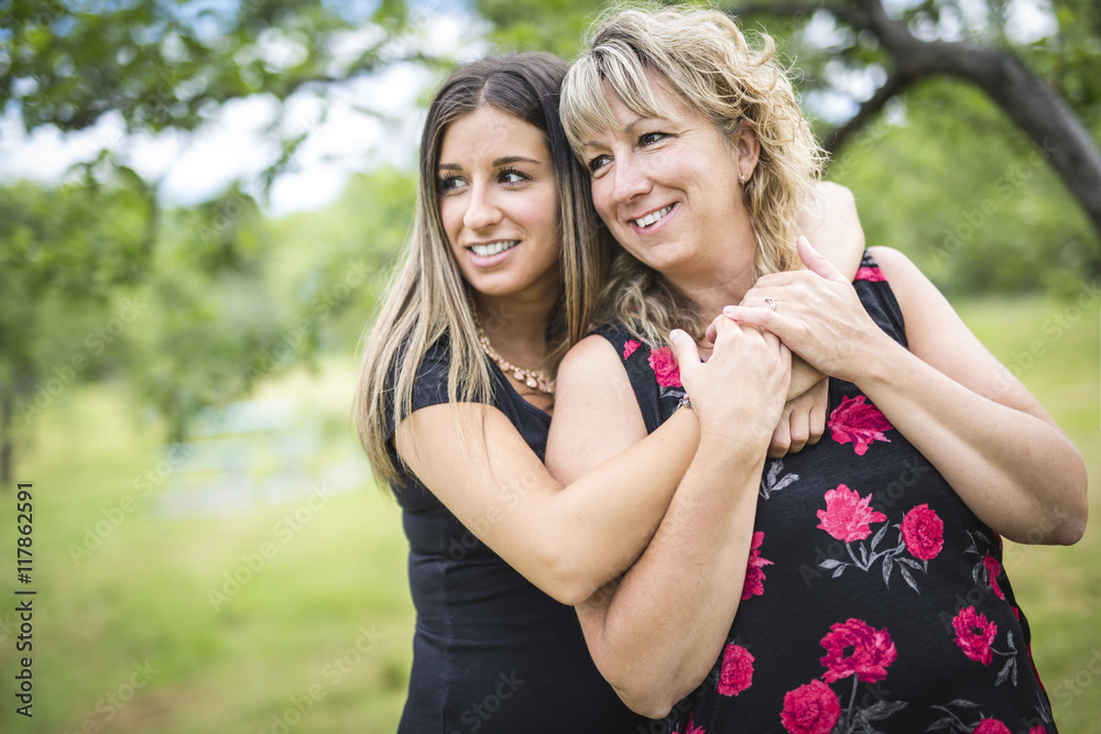 Fototapeta premium adult mother and daughter outside in forest