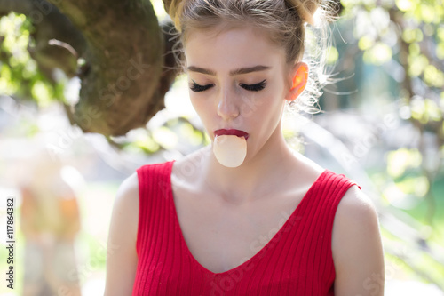 Woman with chewing gum bubble