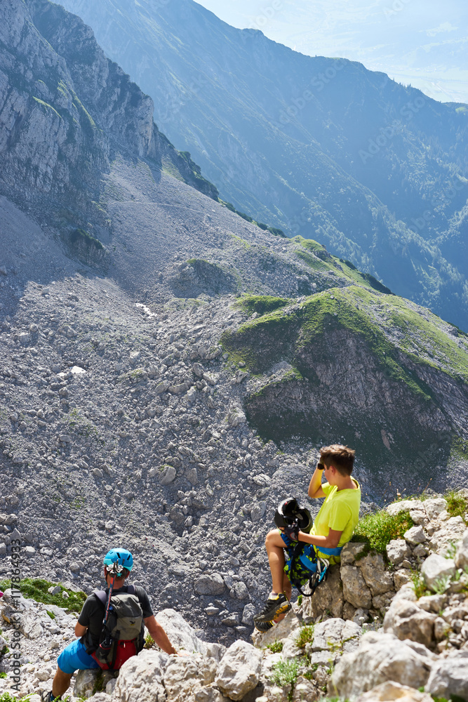 hiker having a break / mountaineers enjoying view hiker having a break / mountaineers enjoying view