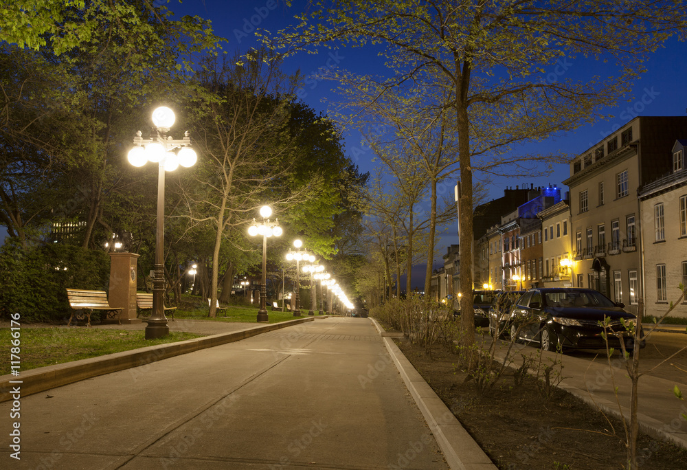 Old quebec city street with lamps in evening
