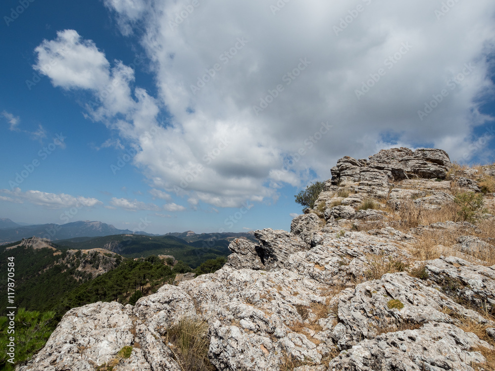 Mountain boulder under blue sky Mountain boulder under blue sky