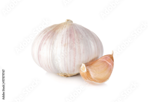 uncooked whole garlic with shell on white background