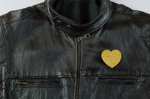 Heart of gold on old black leather jacket