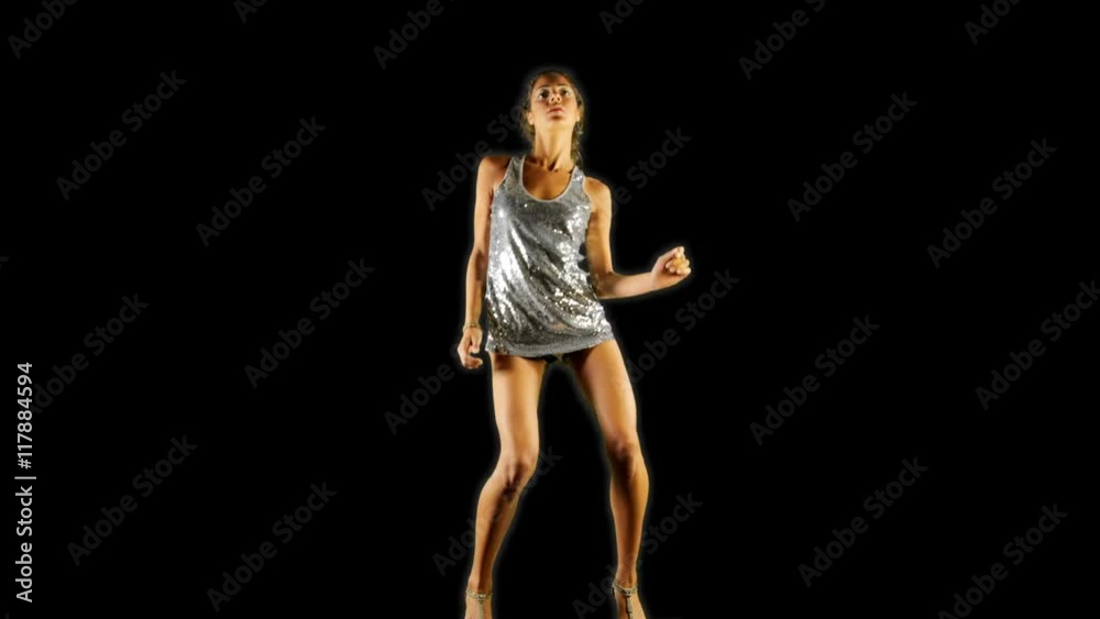 woman dances in a sparkly disco dress woman dances in a sparkly disco dress