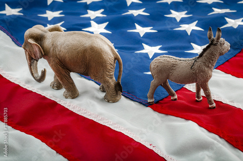 Partisan politics of the democrats and republicans are creating a lack of bipartisan consensus. In American politics US parties are represented by either the democrat donkey or republican elephant photo