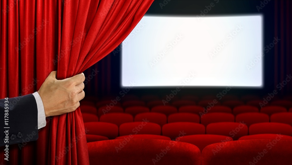 Obraz premium Hand opening curtain before movie show