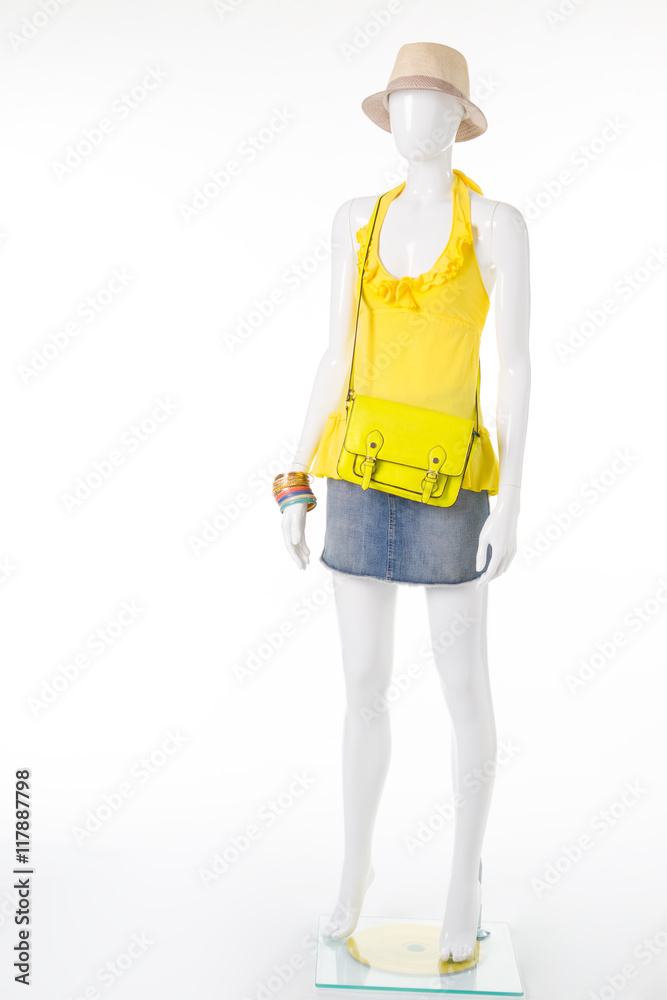 Mannequin in yellow sleeveless top. Mannequin in yellow sleeveless top.