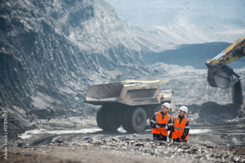 Workers with coal at open pit