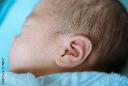 baby ear asia  while sleeping covered  at the hospital