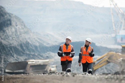 Workers with coal at open pit photo