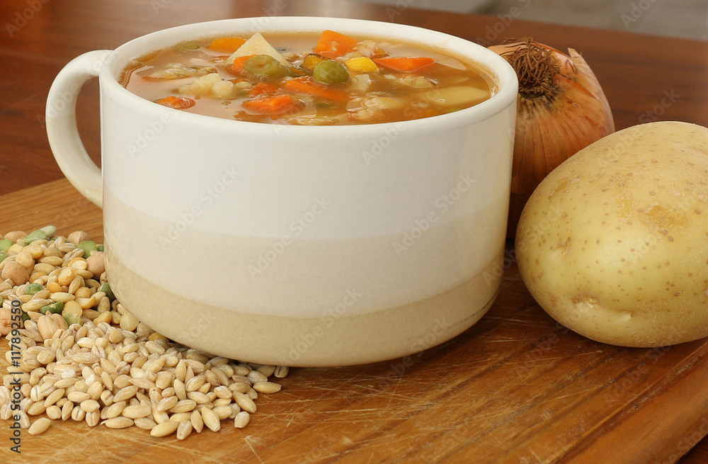 vegetable soup in a soup mug with vegetables and legumes vegetable soup in a soup mug with vegetables and legumes