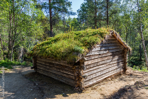 Traditional Sami loghouse with green roof in Lapland Scandinavia