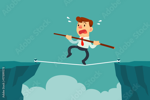 businessman walk on rope across cliff gap