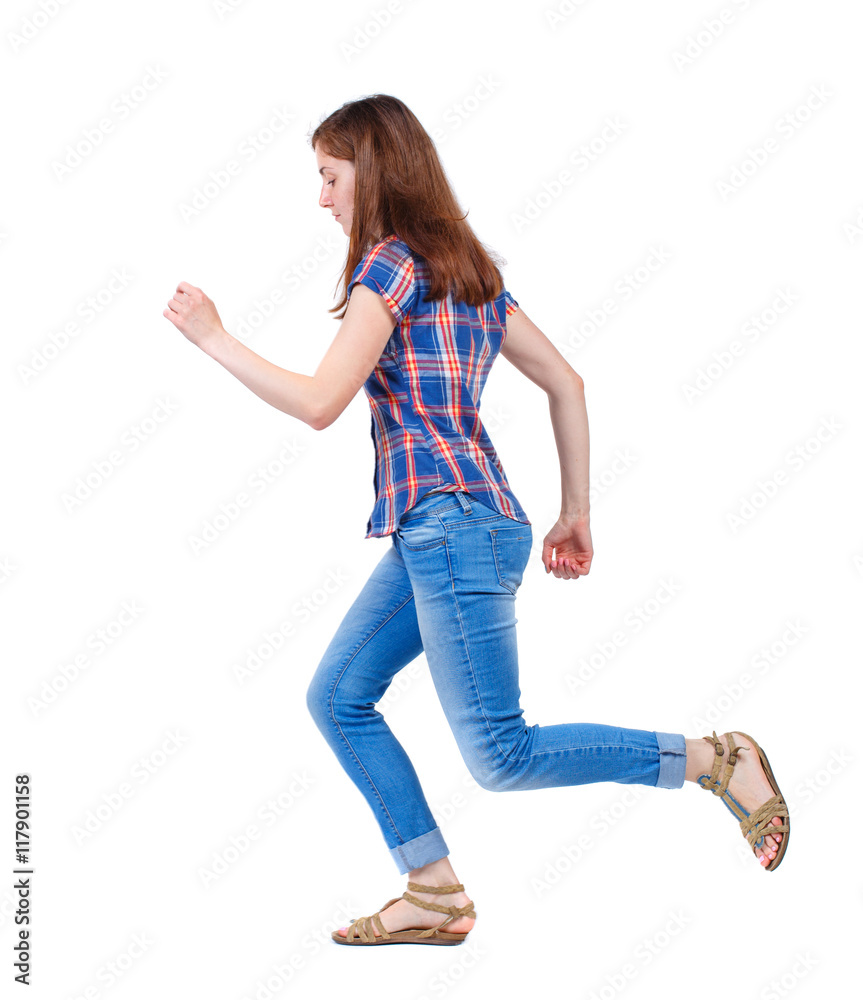 side view of running woman. beautiful girl in motion. backside view of person. Rear view people collection. Isolated over white background. Girl in plaid shirt runs off to the side. side view of running woman. beautiful girl in motion. backside view of person. Rear view people collection. Isolated over white background. Girl in plaid shirt runs off to the side.