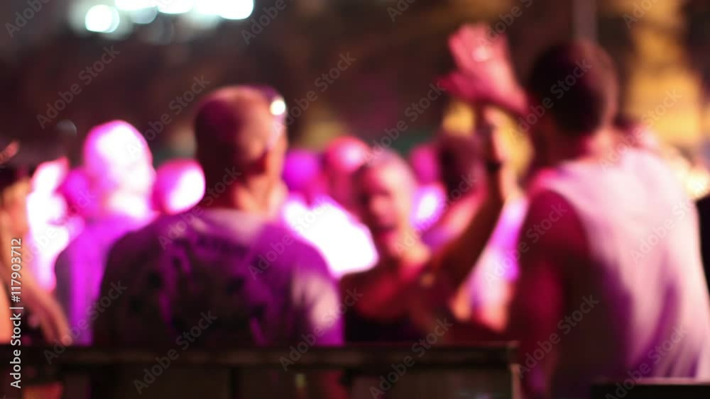 dancers at an outdoor electronic music event dancers at an outdoor electronic music event