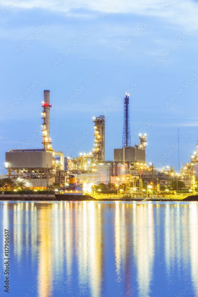 Oil refinery plant at dusk.