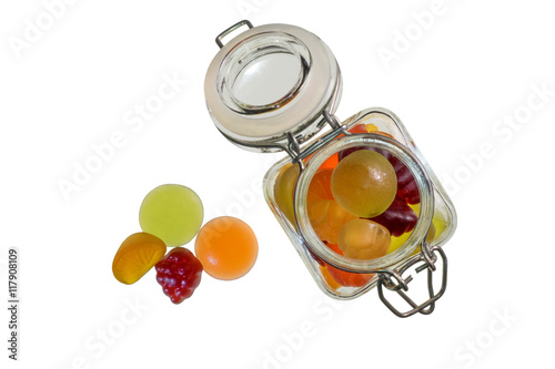 Fruit gummi candies with bottle assortment on white