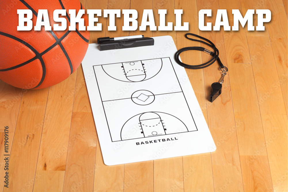 Naklejka premium Basketball camp letters on background of wooden floor with clipb