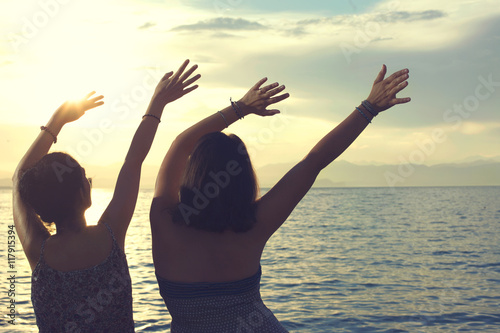 young women do the wave at a party at sea