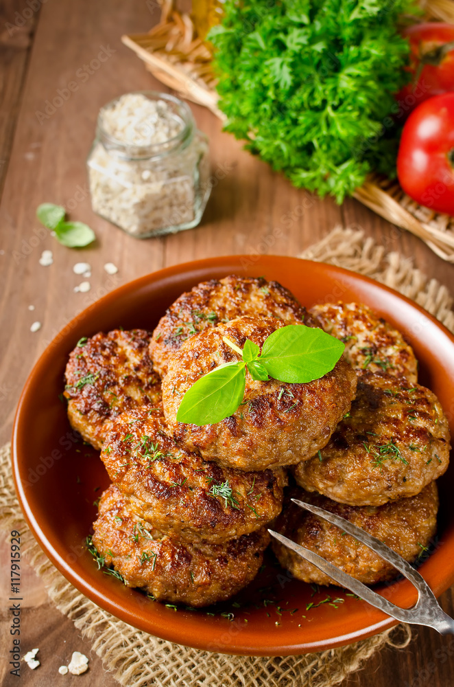 Juicy delicious cutlets with oatmeal. Rustic style Juicy delicious cutlets with oatmeal. Rustic style