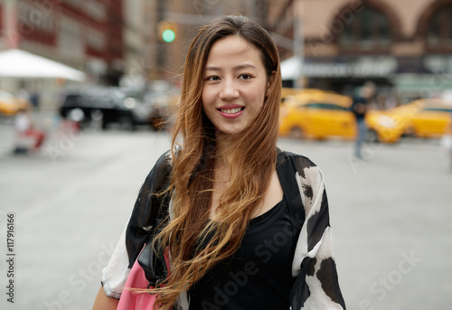 Valokuva Young Asian woman in city walking smile happy face