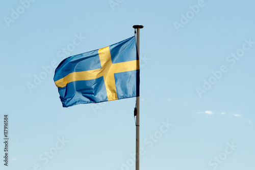 Flag of Sweden against a deep blue sky