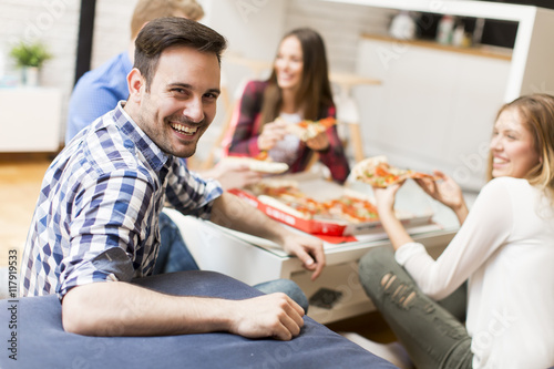 Friends eating pizza in th ...