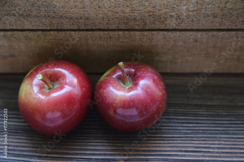 fresh red apples on a wooden background