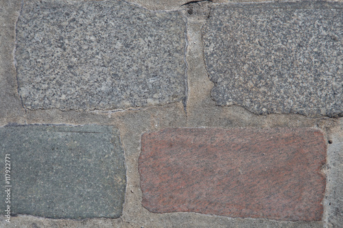 Grey and red brick stone street sidewalk,