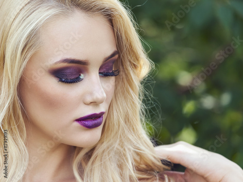 outdoor portrait of fashion young beautiful woman with long blon