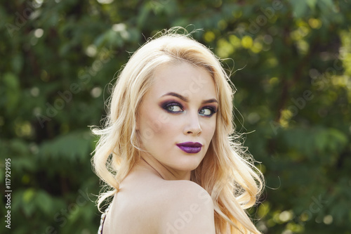 outdoor portrait of fashion young beautiful woman with long blon