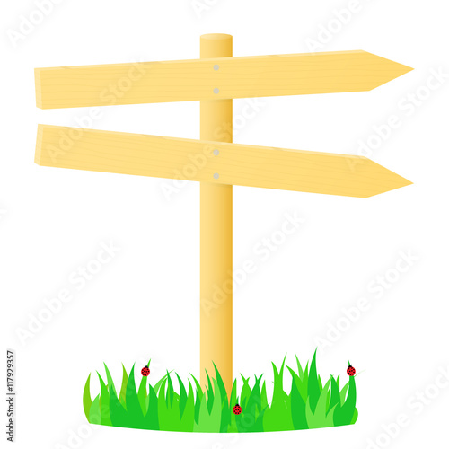 Wooden pointer in the green grass.
