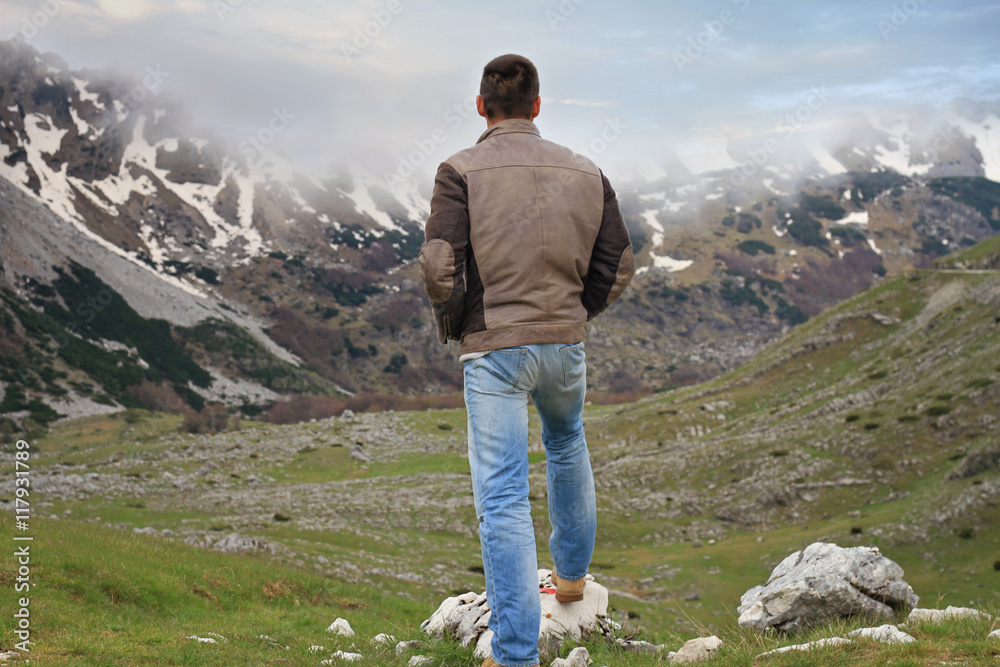 Man enjoying mountain valley view. Freedom , Travel, wanderlust concept.